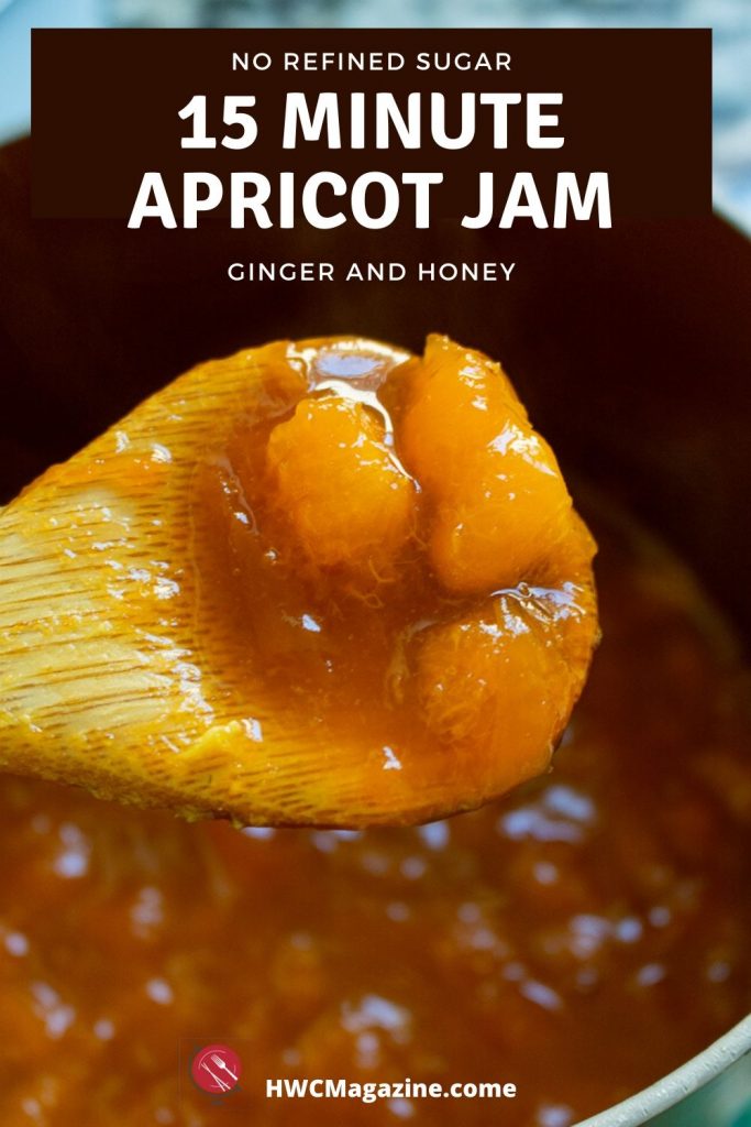 Dollop of apricot jam on a wooden spoon.