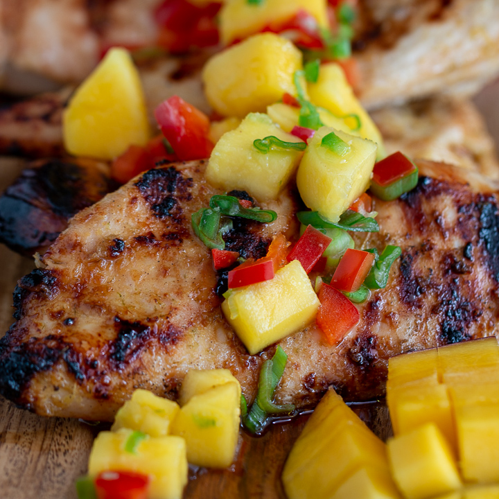 Grilled Mango Chicken with mango salsa on top.