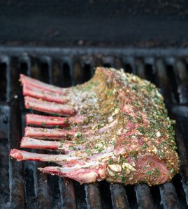 Prepared Rack of lamb ob the grill skin side down.