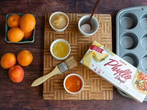 All the ingredients laid out on a cutting board with a pastry brush.