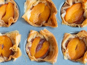 Mini Apricot Tarts fresh out of the oven in the cupcake pan.