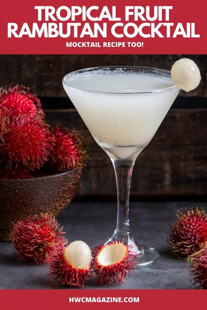 Icy cold Tropical Fruit Rambutan Cocktail in a martini glass with a bowl of fresh rambutans in a wooden bowl.