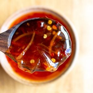 Thai sweet chili glaze in a spoon.