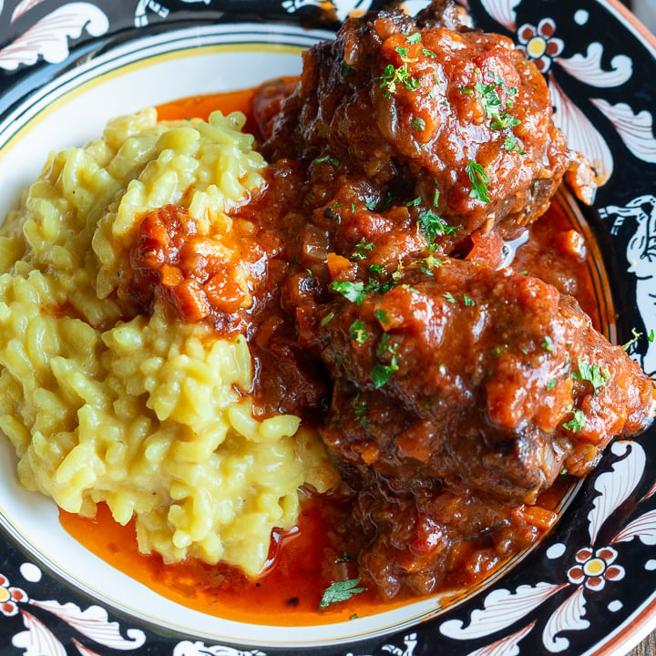 Delicious bowl of risotto Milanese and fall of the bone tender Pressure Cooker oxtail stew.