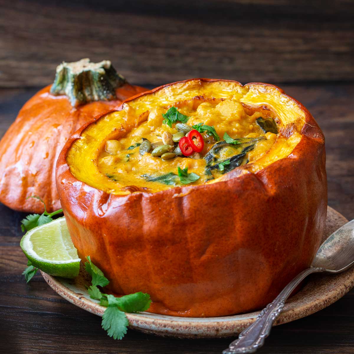 Thai pumpkin curry in a whole roasted pumpkin.