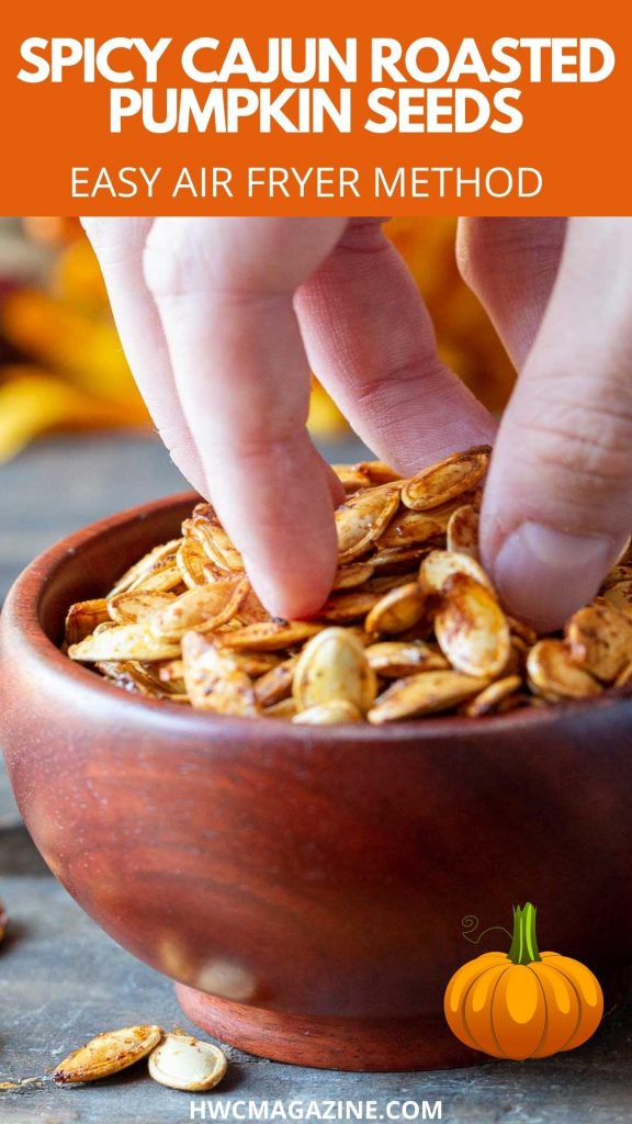 Grabbing a handful of roasted pumpkin seeds in a wooden bowl.