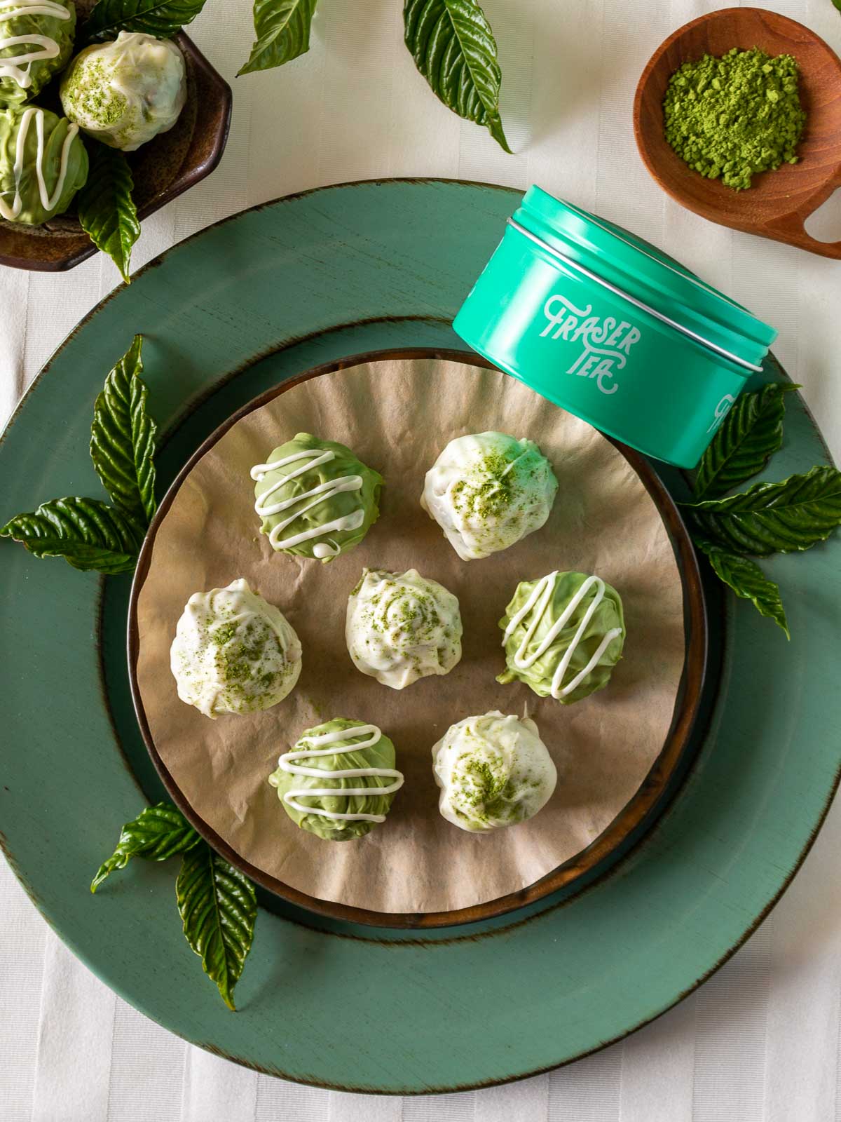 Top down photo of Fraser Tea Matcha truffles on a green plate,