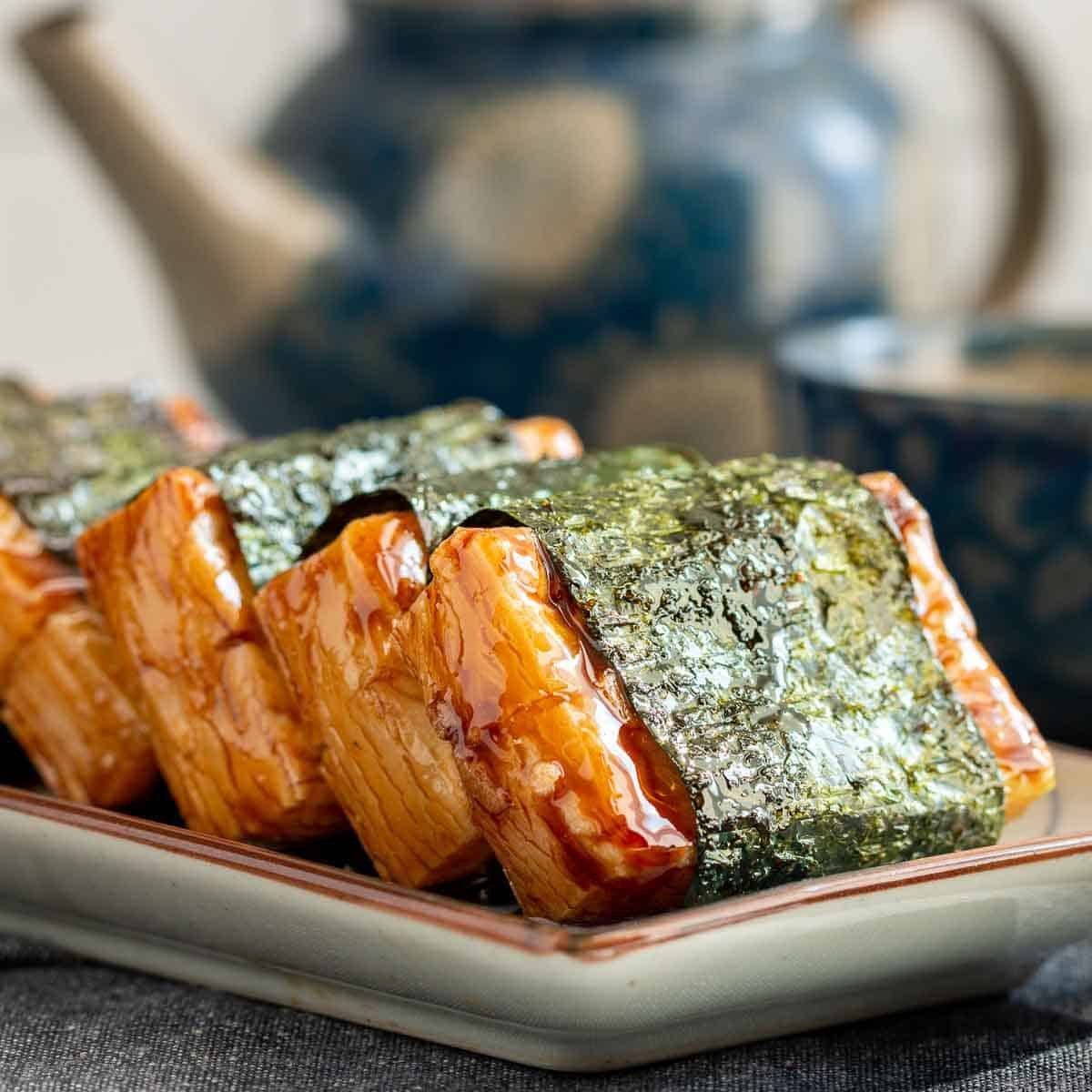 Isobeyaki mochi on a Japanese plate served with green tea.