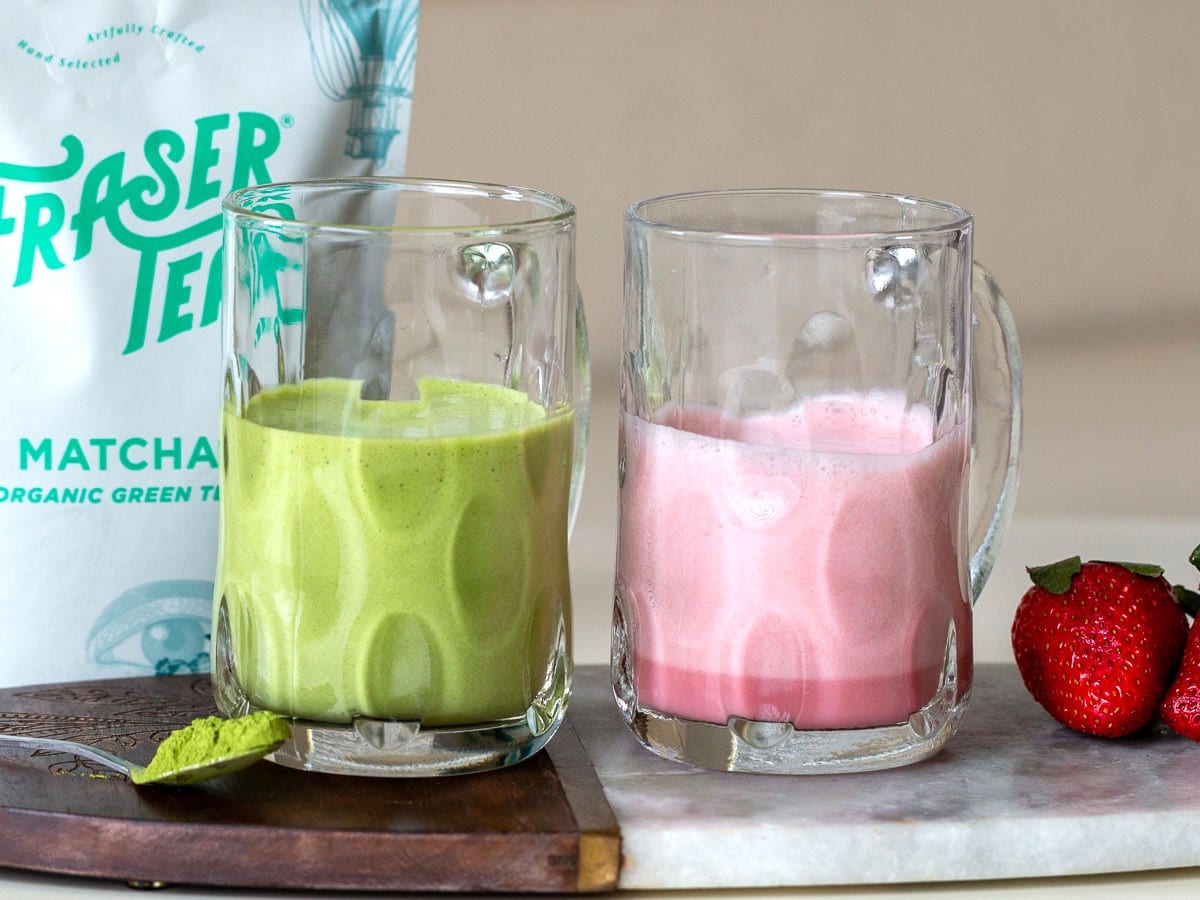 Strawberry and matcha cold foam in clear mugs.