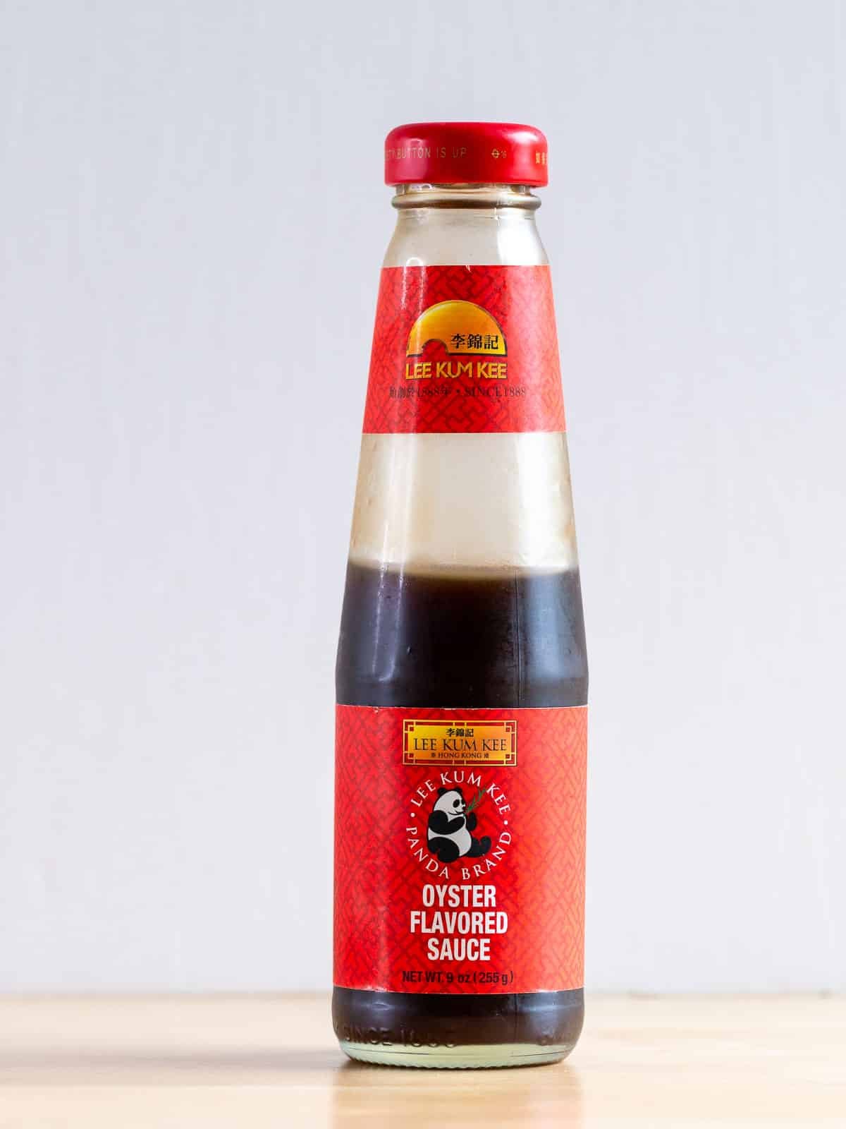 Lee Kum Lee oyster sauce on the wooden table.