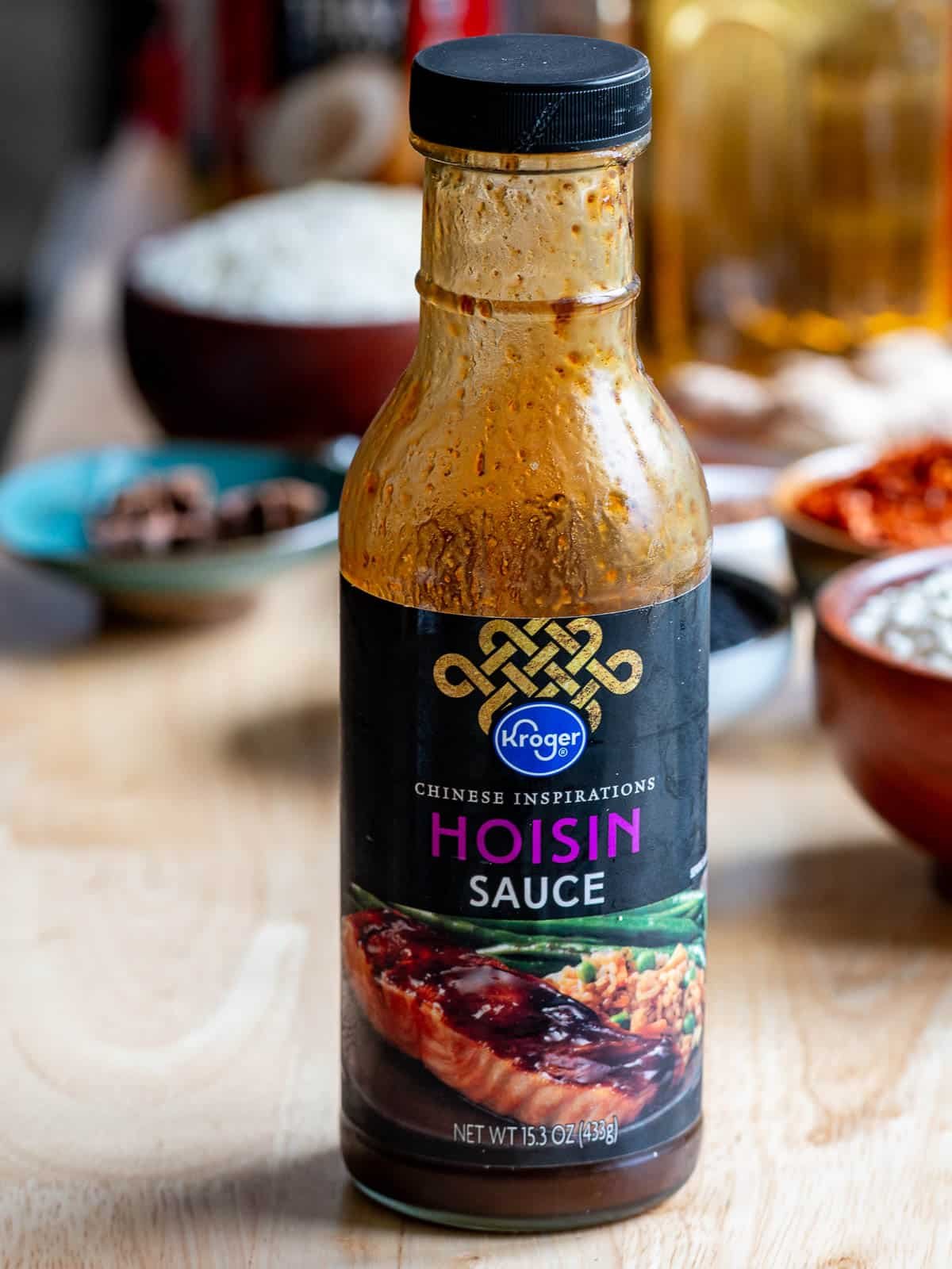 Hoisin sauce sitting on the table getting ready to make a stir fry.