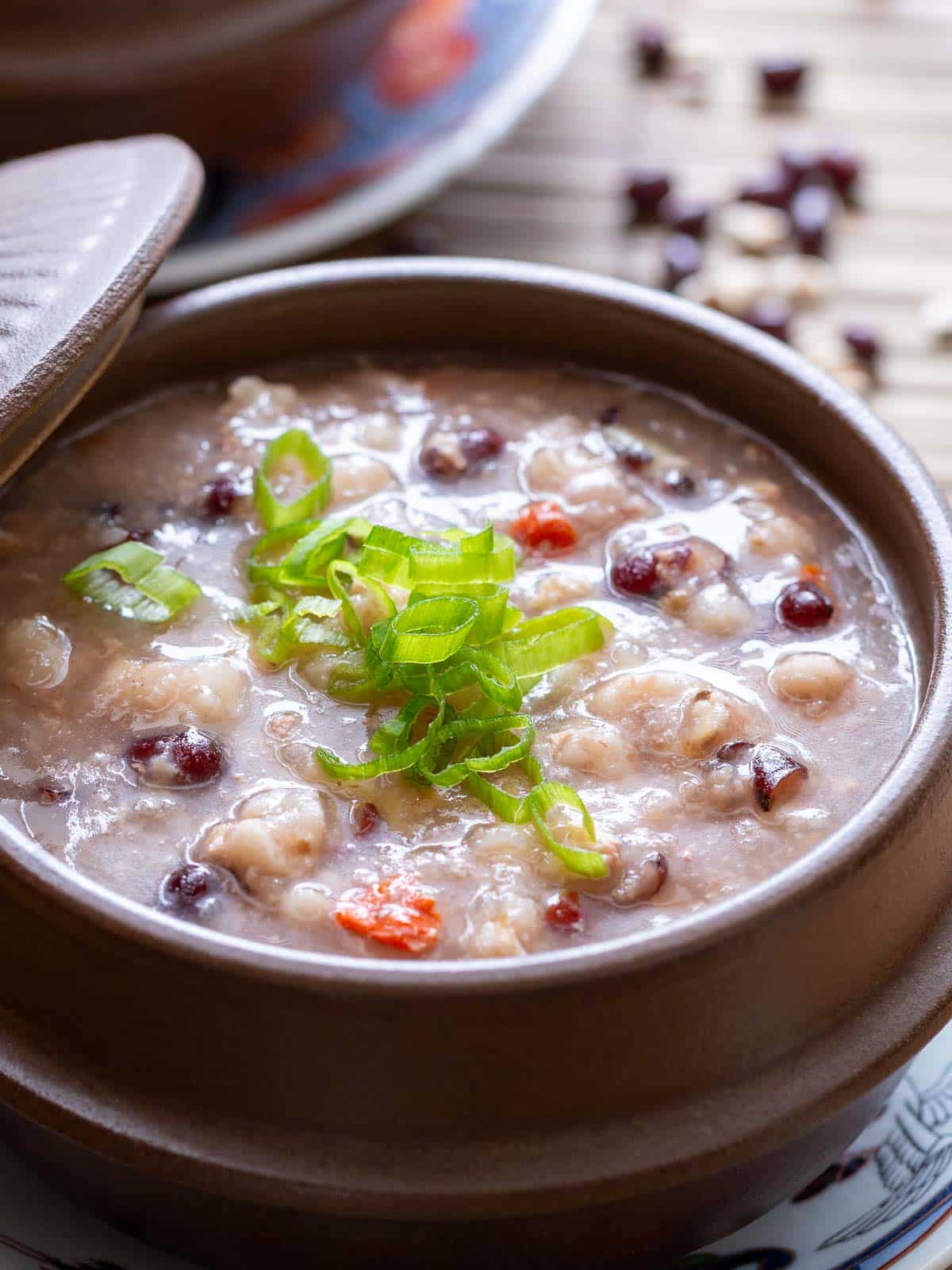 Close up showing all the ingredients of the warm and cozy congee. 