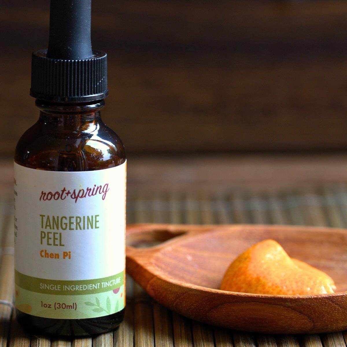 Dried aged mandarin orange peel drops and  fresh mandarin orange peel.