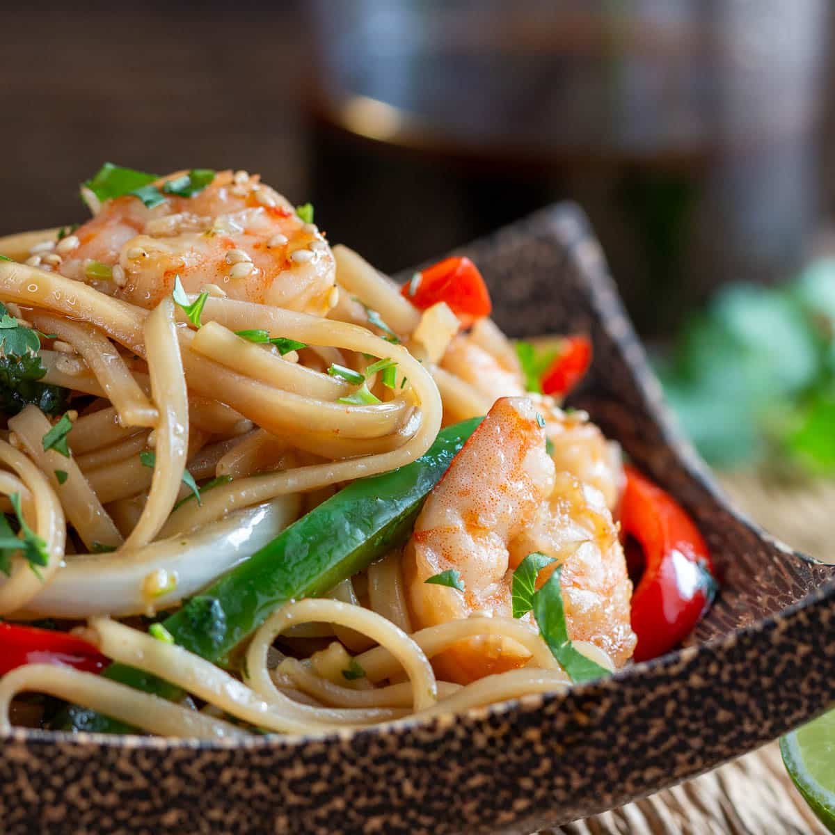 Chili lime cilantro noodles in a wooden bowl. 