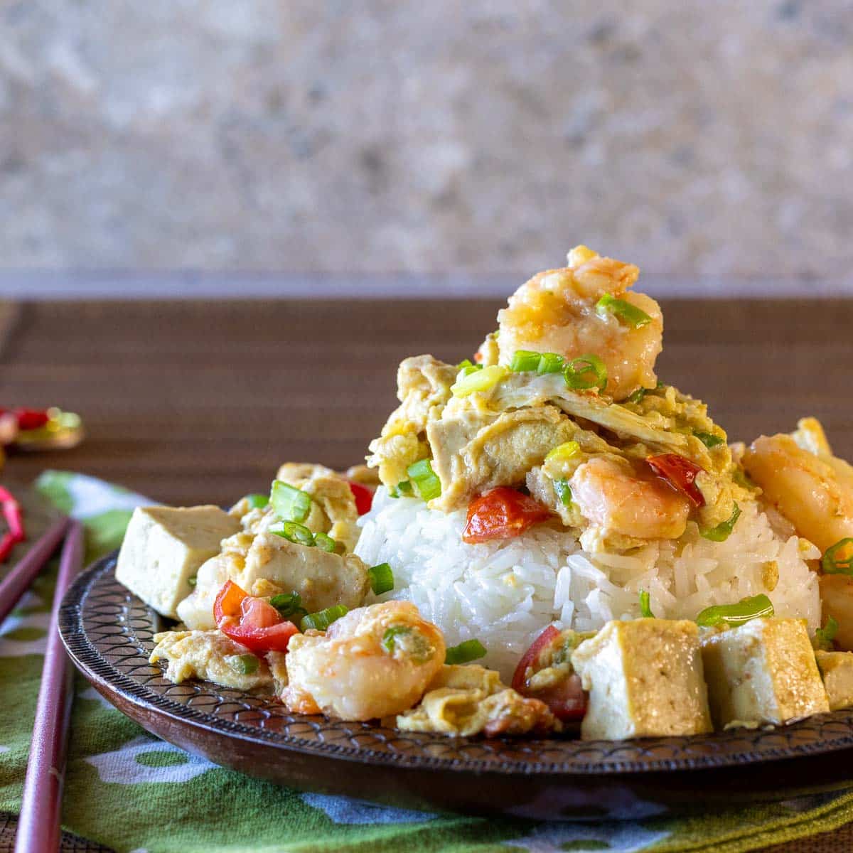 Chinese style Scrambled eggs, shrimp and tofu with a ginger scallions sauce over rice.